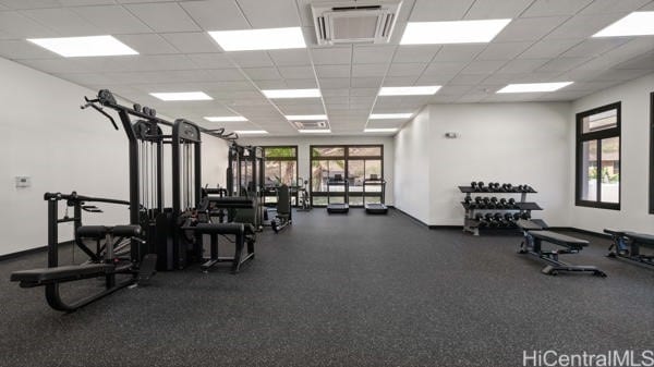 gym featuring a paneled ceiling