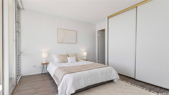 bedroom featuring a closet and hardwood / wood-style flooring