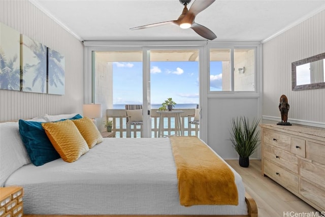 bedroom with ceiling fan, light wood-type flooring, crown molding, and multiple windows