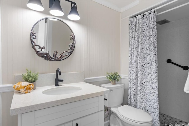 bathroom featuring toilet, a shower with shower curtain, crown molding, and vanity