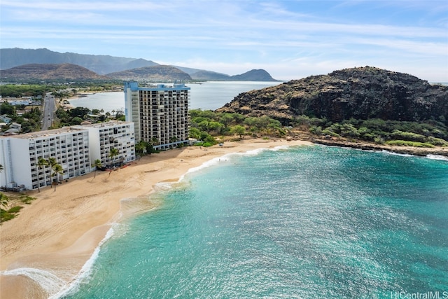 exterior space with a water and mountain view