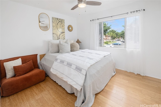 bedroom featuring ceiling fan and light hardwood / wood-style flooring