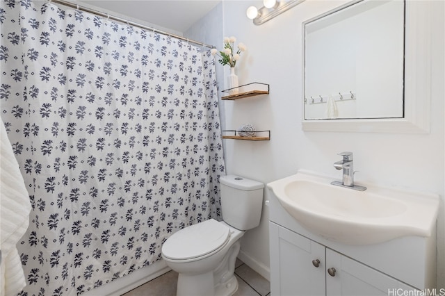 bathroom with a shower with shower curtain, tile patterned floors, vanity, and toilet