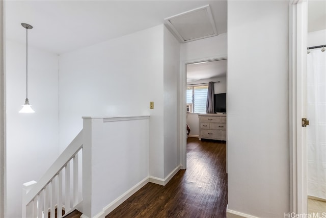 hallway with dark hardwood / wood-style flooring