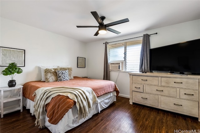 bedroom featuring dark hardwood / wood-style floors, ceiling fan, and cooling unit