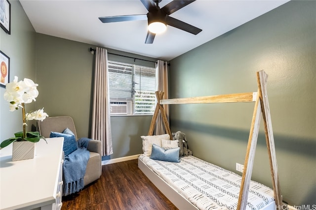 bedroom with ceiling fan, dark hardwood / wood-style flooring, and cooling unit