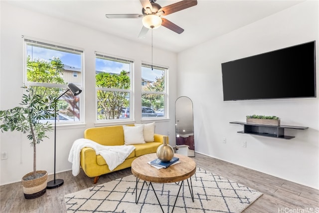 living room featuring hardwood / wood-style flooring and ceiling fan