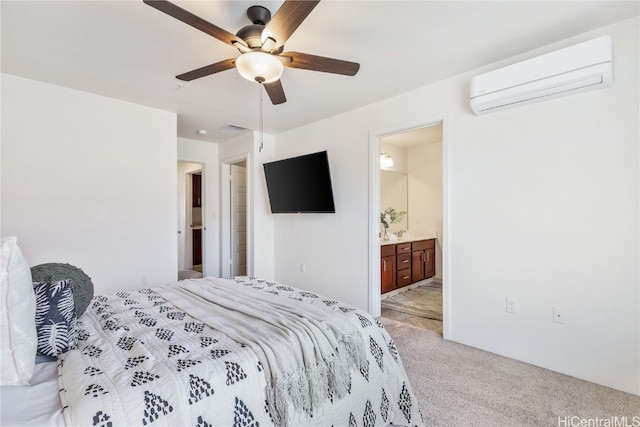 carpeted bedroom with a wall unit AC, ceiling fan, and connected bathroom