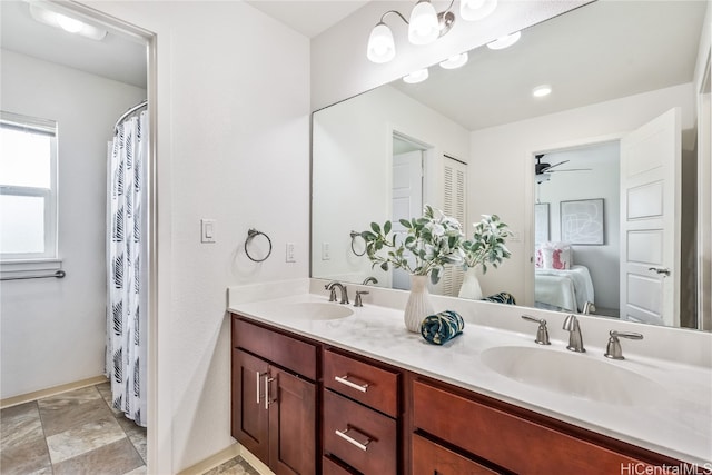 bathroom featuring ceiling fan and vanity