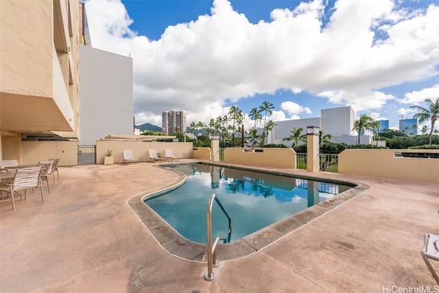 view of pool featuring a patio