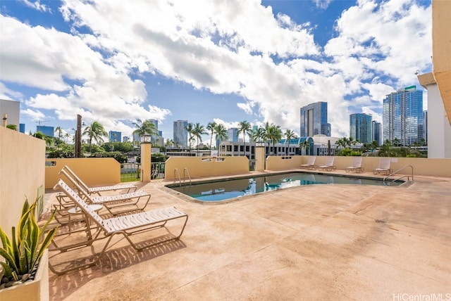 view of swimming pool featuring a patio