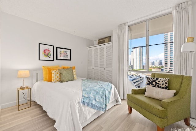 bedroom featuring hardwood / wood-style floors and a closet