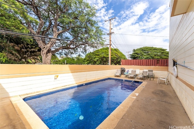 view of swimming pool featuring a patio area