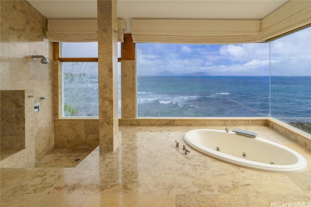 bathroom with a water view and independent shower and bath