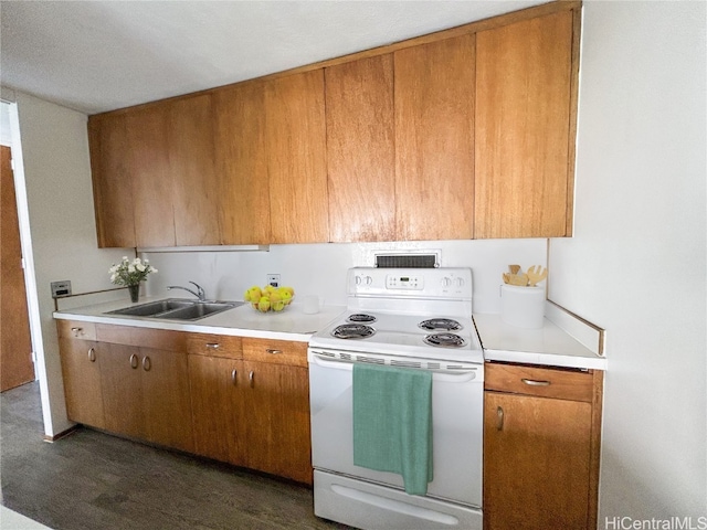 kitchen featuring white electric range oven and sink