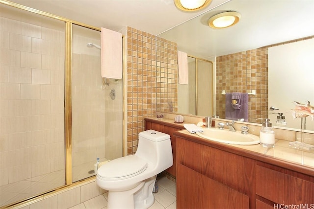 bathroom featuring toilet, an enclosed shower, and tile patterned floors