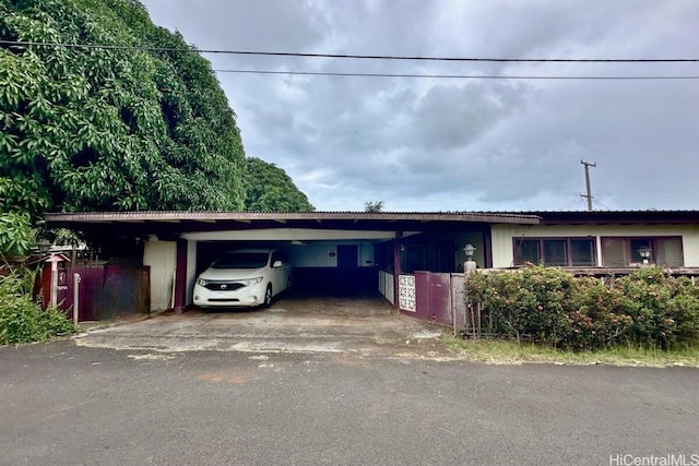 ranch-style house with a carport