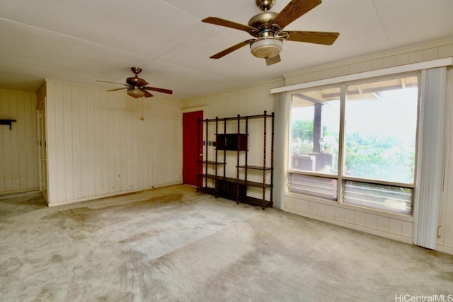 spare room with light carpet and ceiling fan