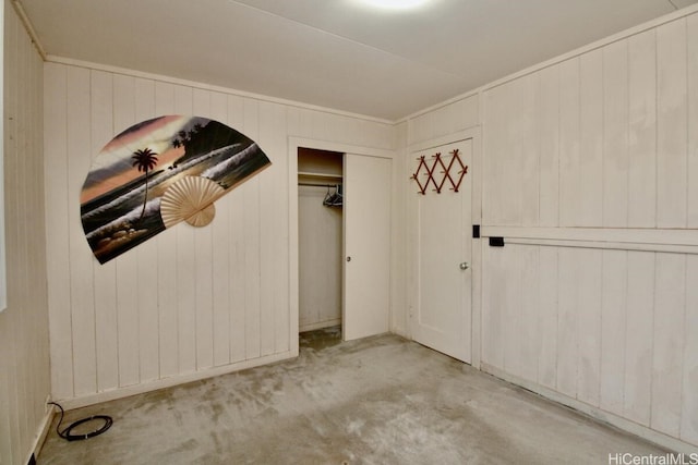 interior space featuring light carpet and wooden walls