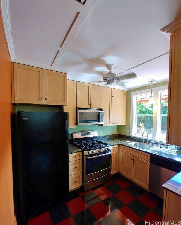 kitchen featuring light brown cabinetry, ceiling fan, sink, and appliances with stainless steel finishes