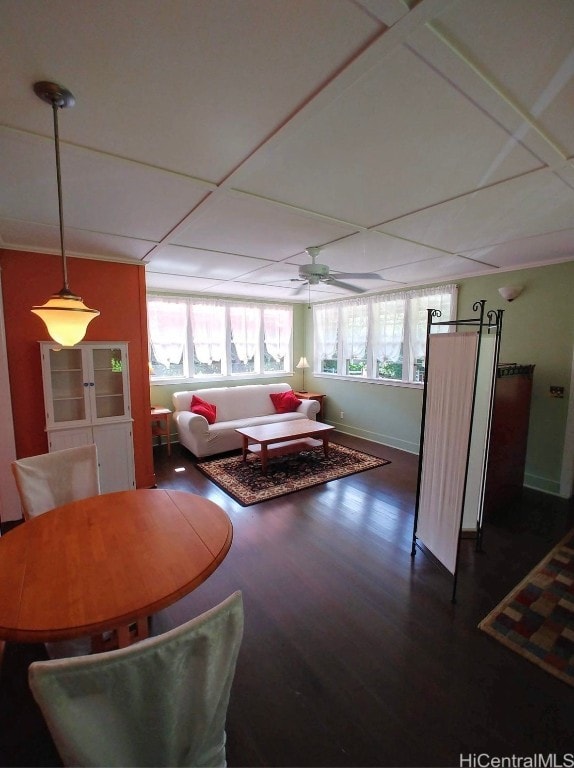 living room featuring dark hardwood / wood-style flooring and ceiling fan