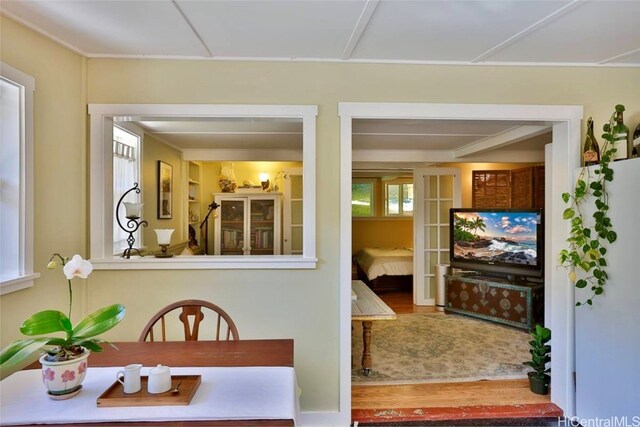 dining space with wood-type flooring