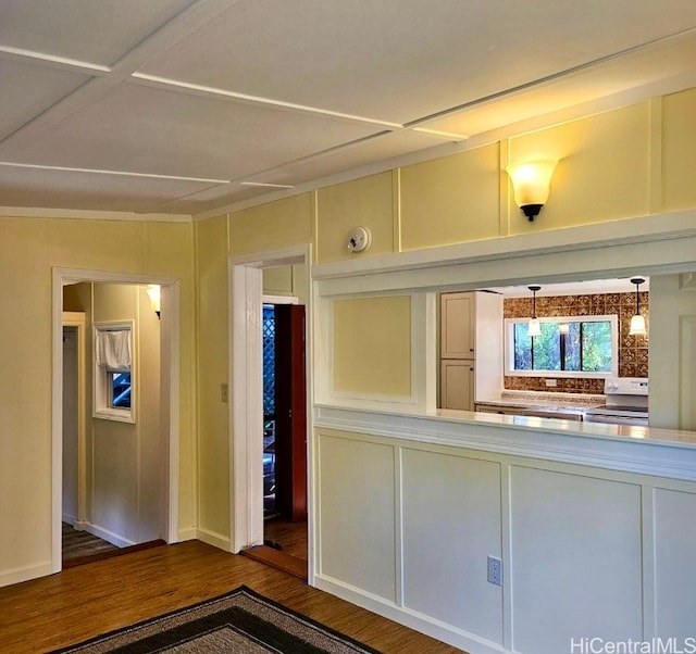 kitchen with hardwood / wood-style flooring, pendant lighting, and white range with electric stovetop