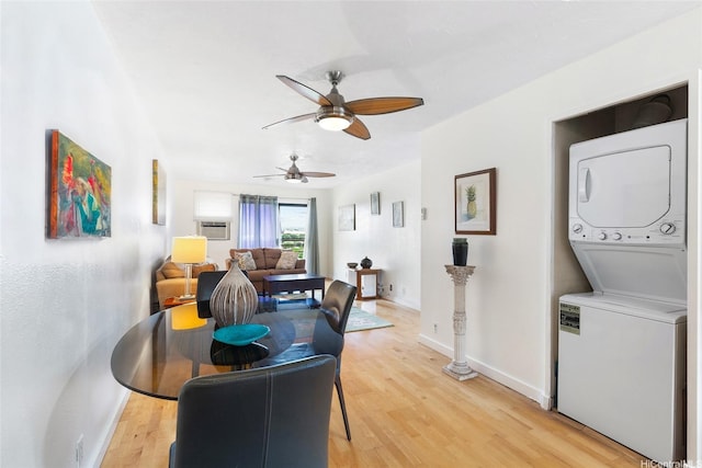 98-626 Moanalua Loop Unit 311, Aiea, HI 96701 - dining room featuring stacked washer and clothes dryer, ceiling fan, light wood finished floors, and baseboards