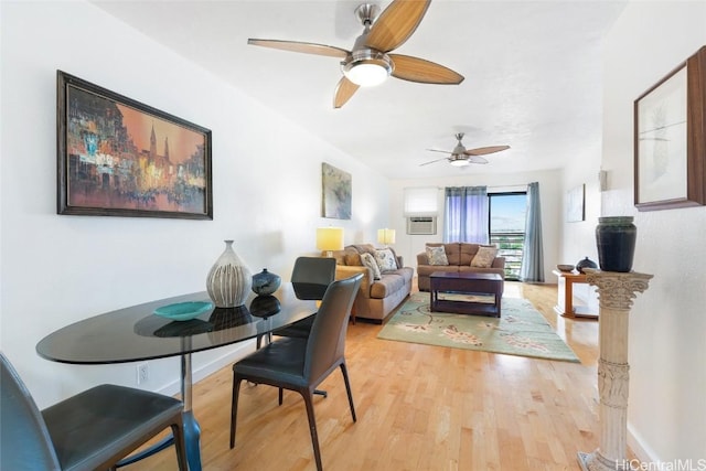 dining space featuring ceiling fan and light hardwood / wood-style flooring