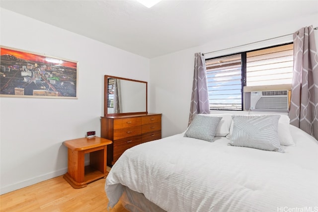 bedroom featuring cooling unit and hardwood / wood-style flooring