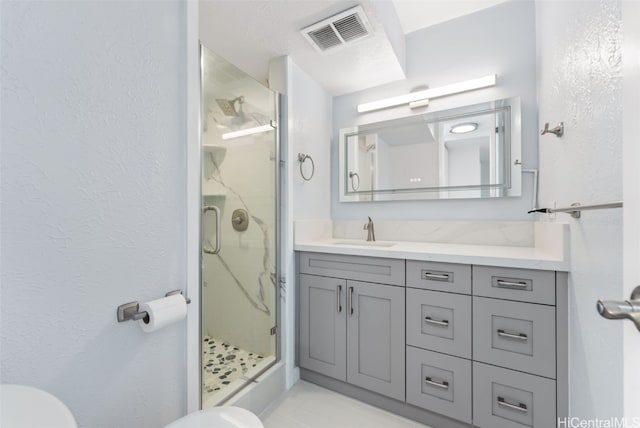 bathroom with vanity and an enclosed shower