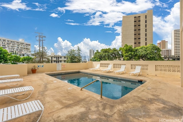 view of swimming pool featuring a patio area