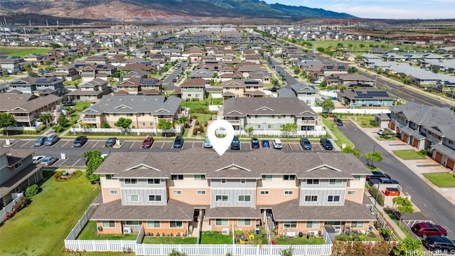 birds eye view of property featuring a mountain view