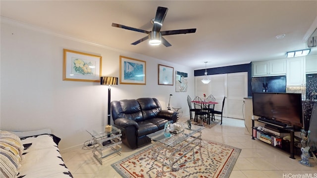 living room featuring crown molding, light tile patterned floors, and ceiling fan