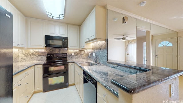 kitchen with black appliances, white cabinetry, kitchen peninsula, and sink