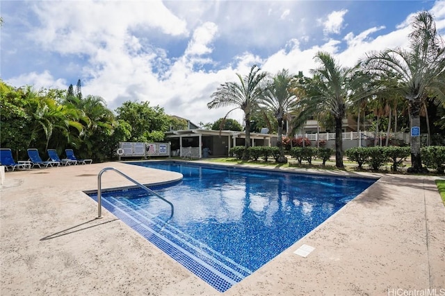 community pool with a patio area