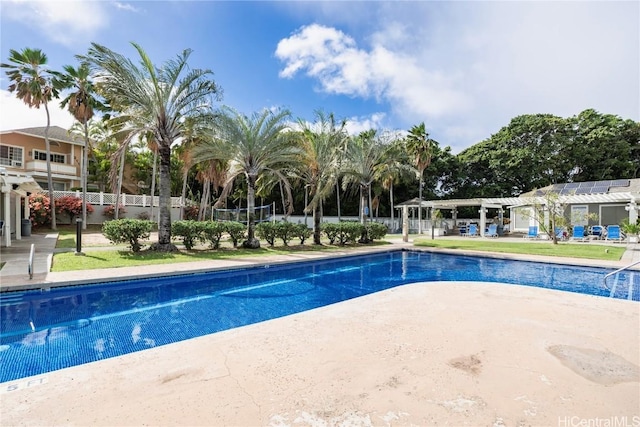 view of swimming pool with a pergola