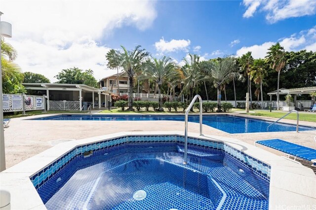 pool with a community hot tub