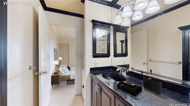 ensuite bathroom featuring ensuite bath, tile patterned flooring, crown molding, and vanity