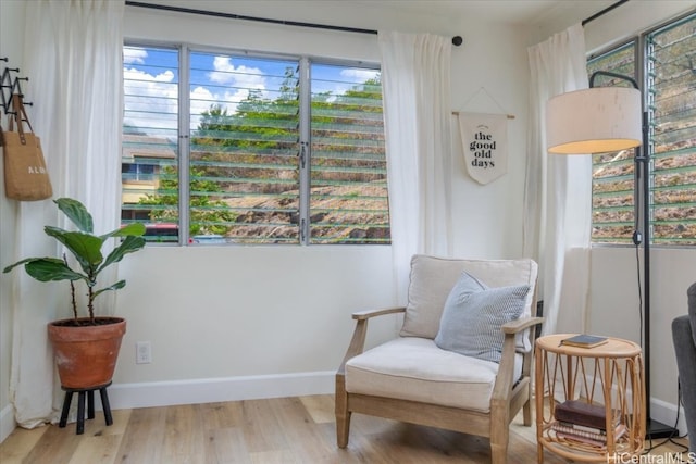 sitting room featuring light hardwood / wood-style flooring