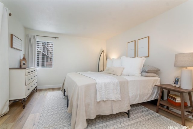 bedroom with light wood-type flooring