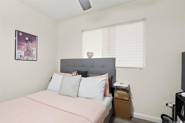 1080 Ala Napunani St Unit 403, Honolulu, HI 96818 - bedroom featuring a ceiling fan and wood finished floors