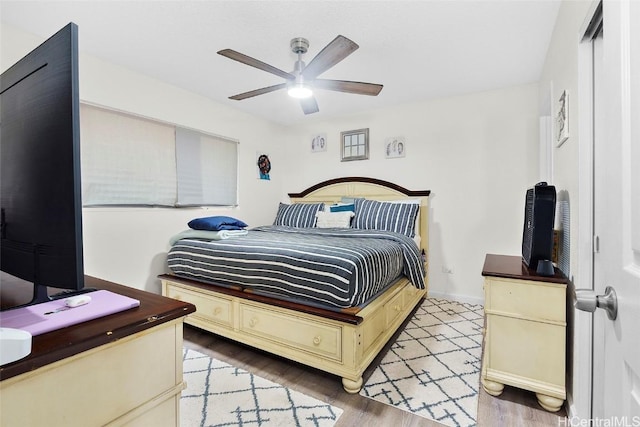 bedroom featuring ceiling fan and light hardwood / wood-style flooring