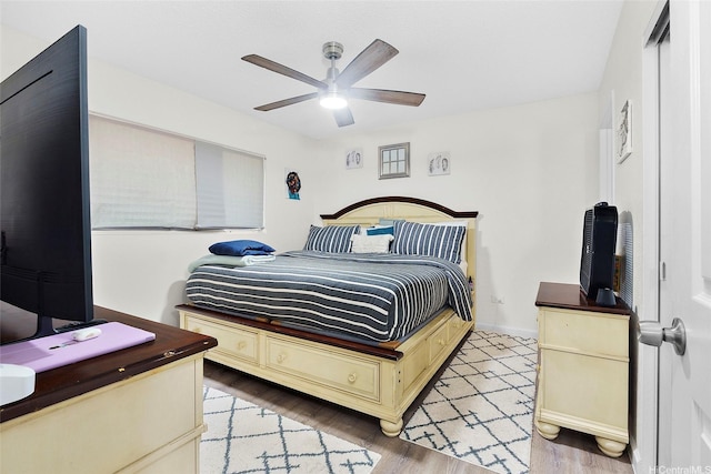 1080 Ala Napunani St Unit 403, Honolulu, HI 96818 - bedroom featuring light wood finished floors and a ceiling fan
