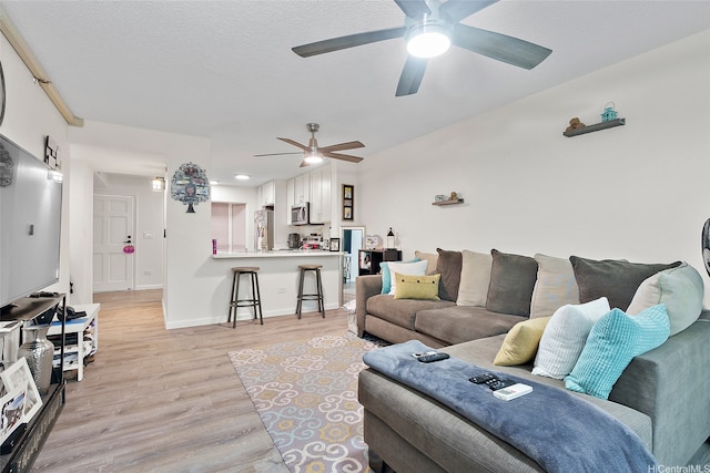 1080 Ala Napunani St Unit 403, Honolulu, HI 96818 - living area featuring light wood-style floors and ceiling fan