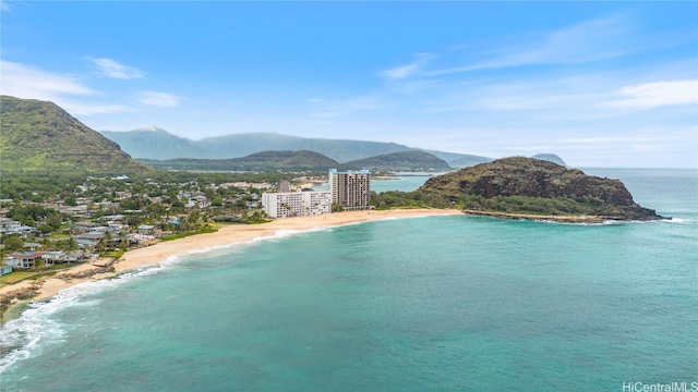 property view of water featuring a mountain view and a beach view