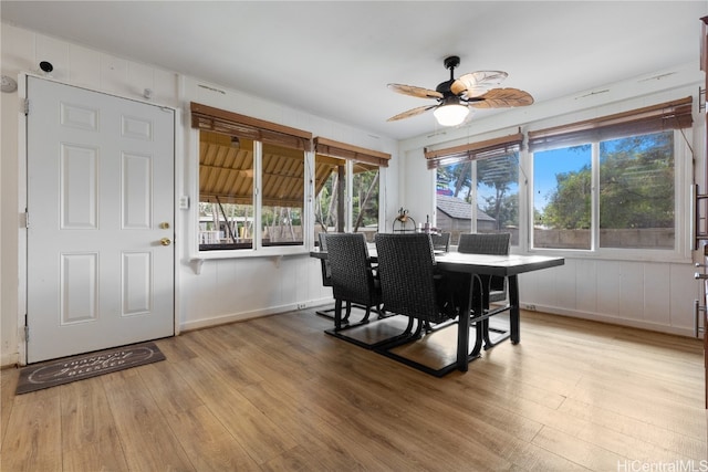 dining area featuring ceiling fan and light wood-type flooring