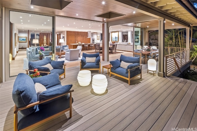 wooden deck featuring an outdoor living space