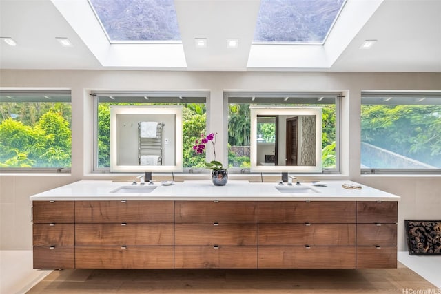 41-471 Kalanianaole Hwy, Waimanalo, HI 96795 - full bath with a skylight, double vanity, and wood finished floors