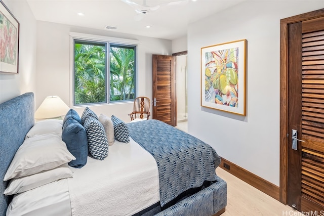 bedroom with light hardwood / wood-style flooring